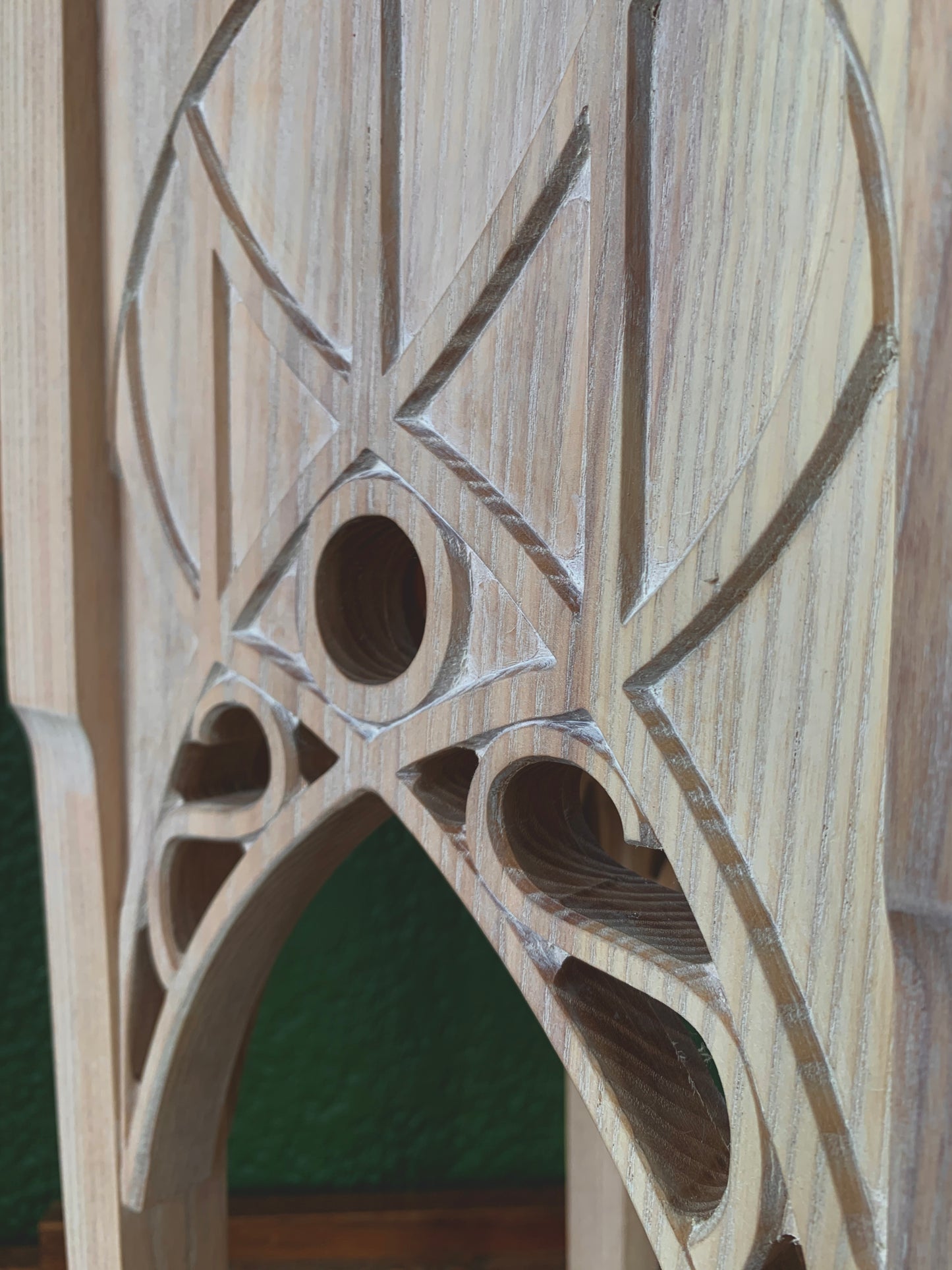 Close up of carved detail in ash wood side table. Rivendell archway